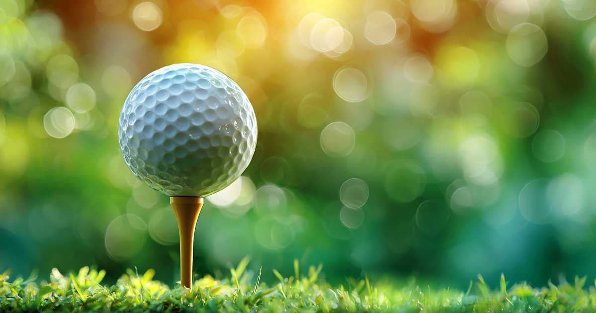 Stock image of a golf ball on a golf course