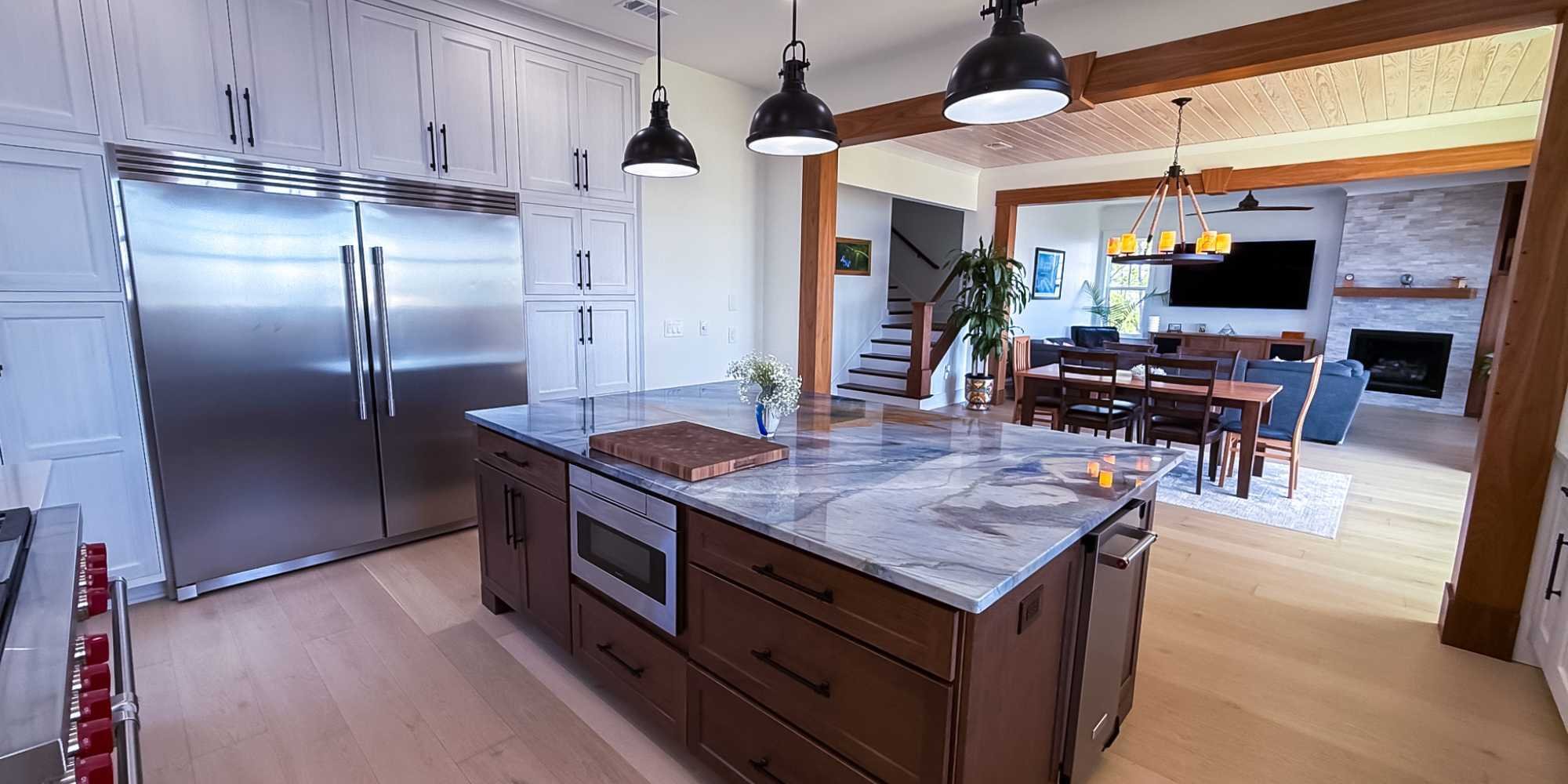 An open concept kitch and lounge area in a custom home by Urban Infill in Pensacola, FL