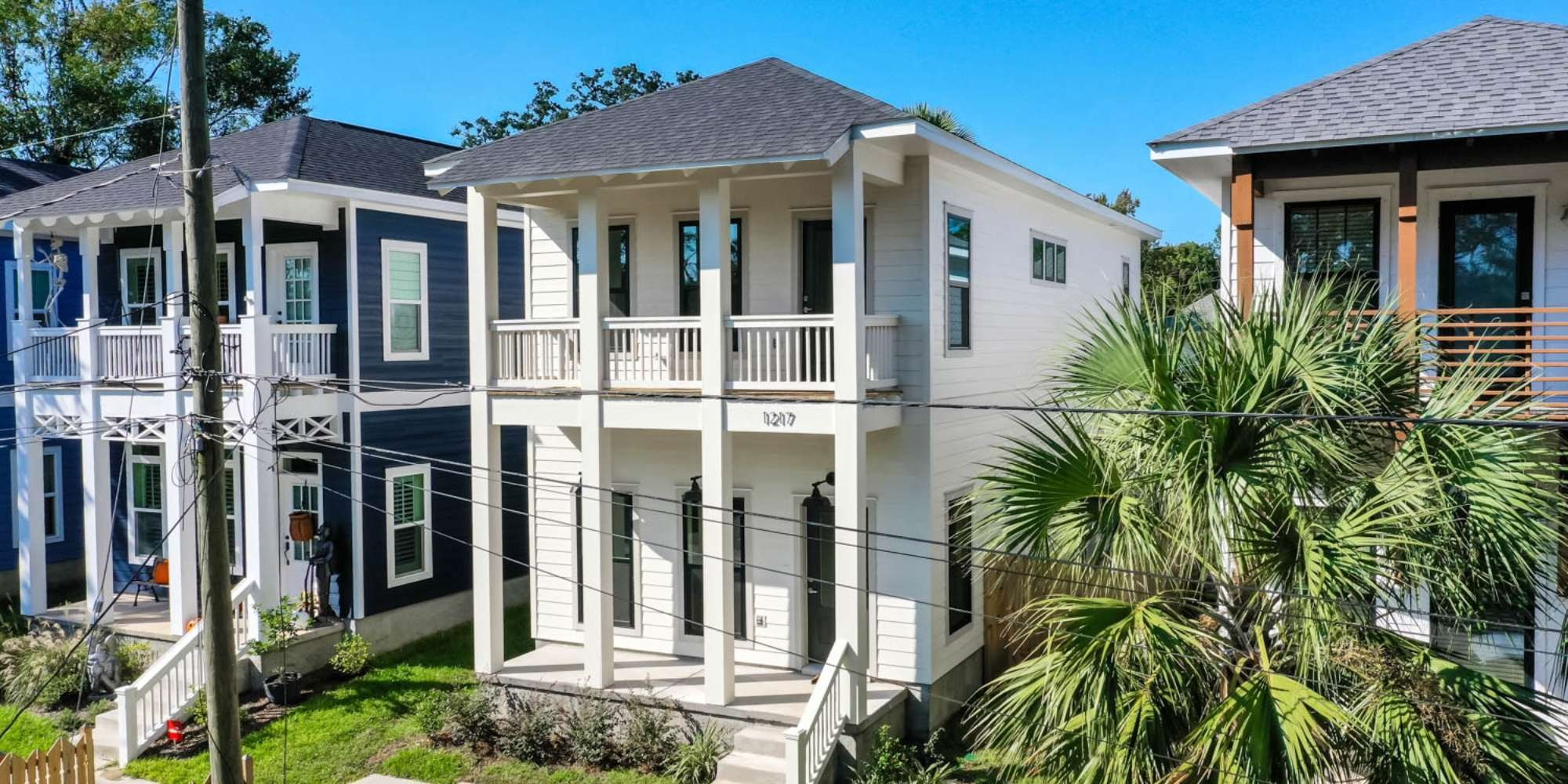 Downtown Pensacola custom infill home with symmetrical porch columns by Urban Infill