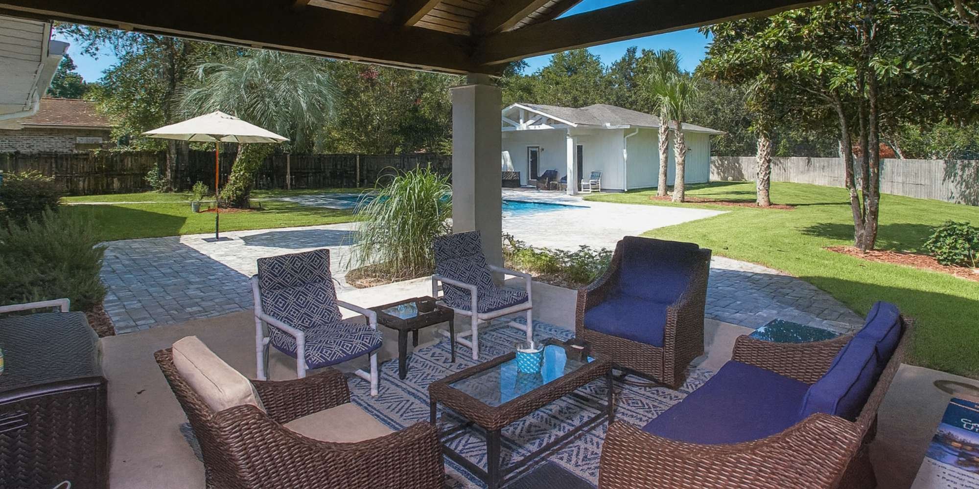 Outdoor living in the backyard of a custom home by Urban Infill in Pensacola, FL