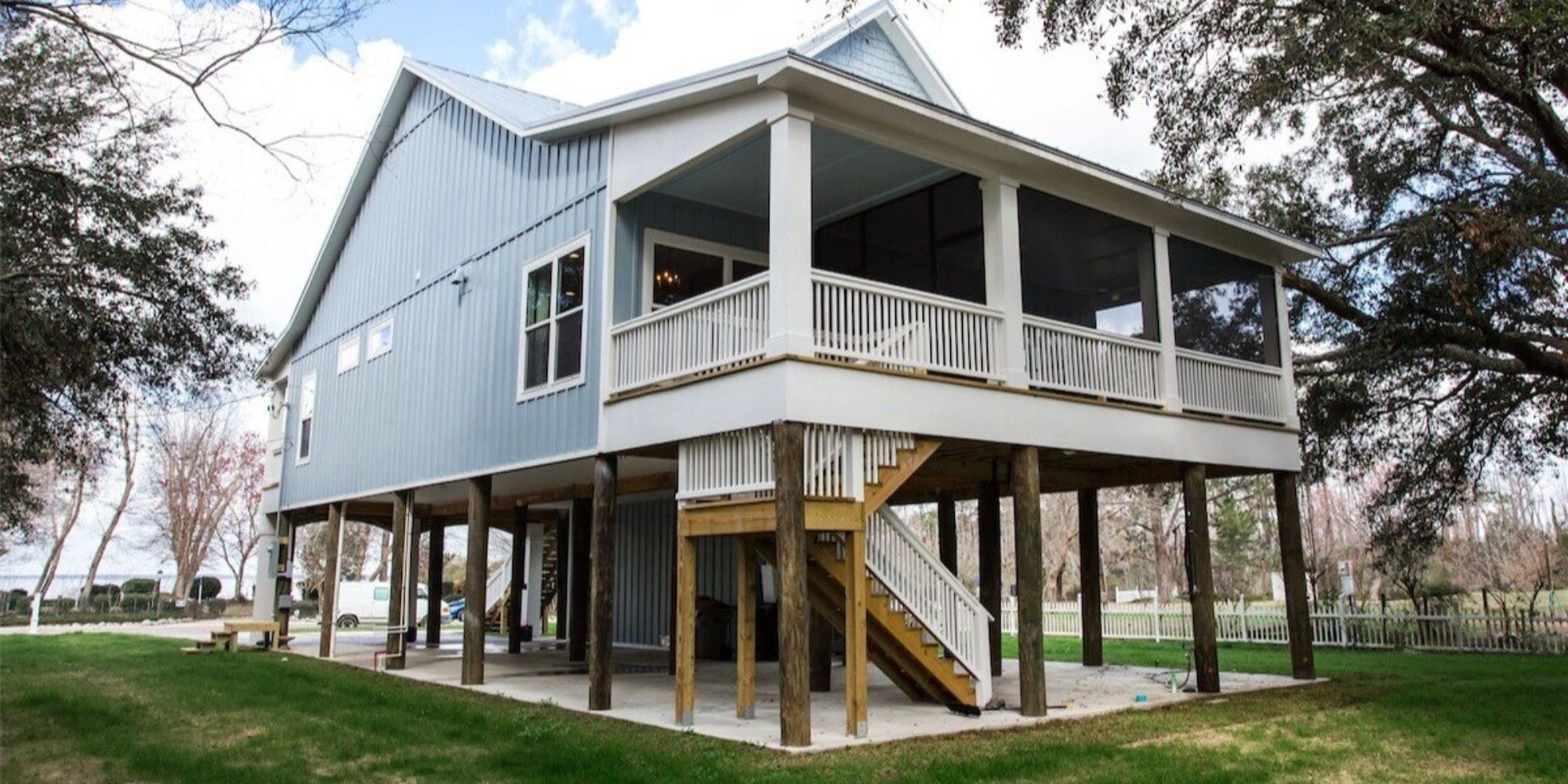 Elevated blue coastal home in Pensacola with screened porch by Urban Infill, custom builder and remodeler Elevated blue coastal home in Pensacola with screened porch by Urban Infill, custom builder and remodeler