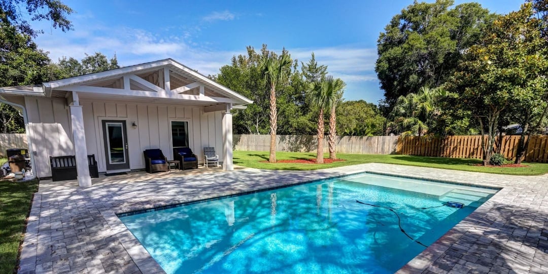 Backyard pool and patio in Pensacola outdoor living remodel by Urban Infill